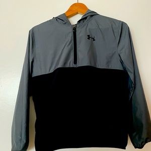 Under Amour Boys youth large rain jacket. Jacket makes into a backpack